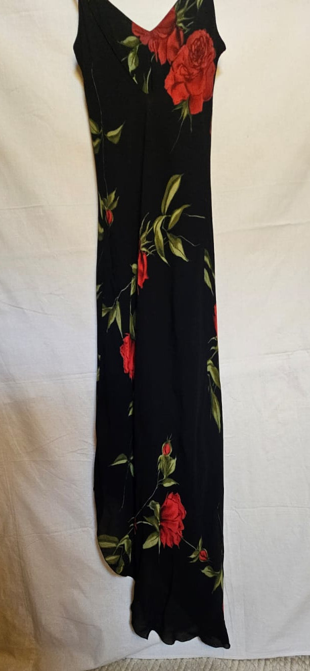 Black dress with red floral patterns on a white background