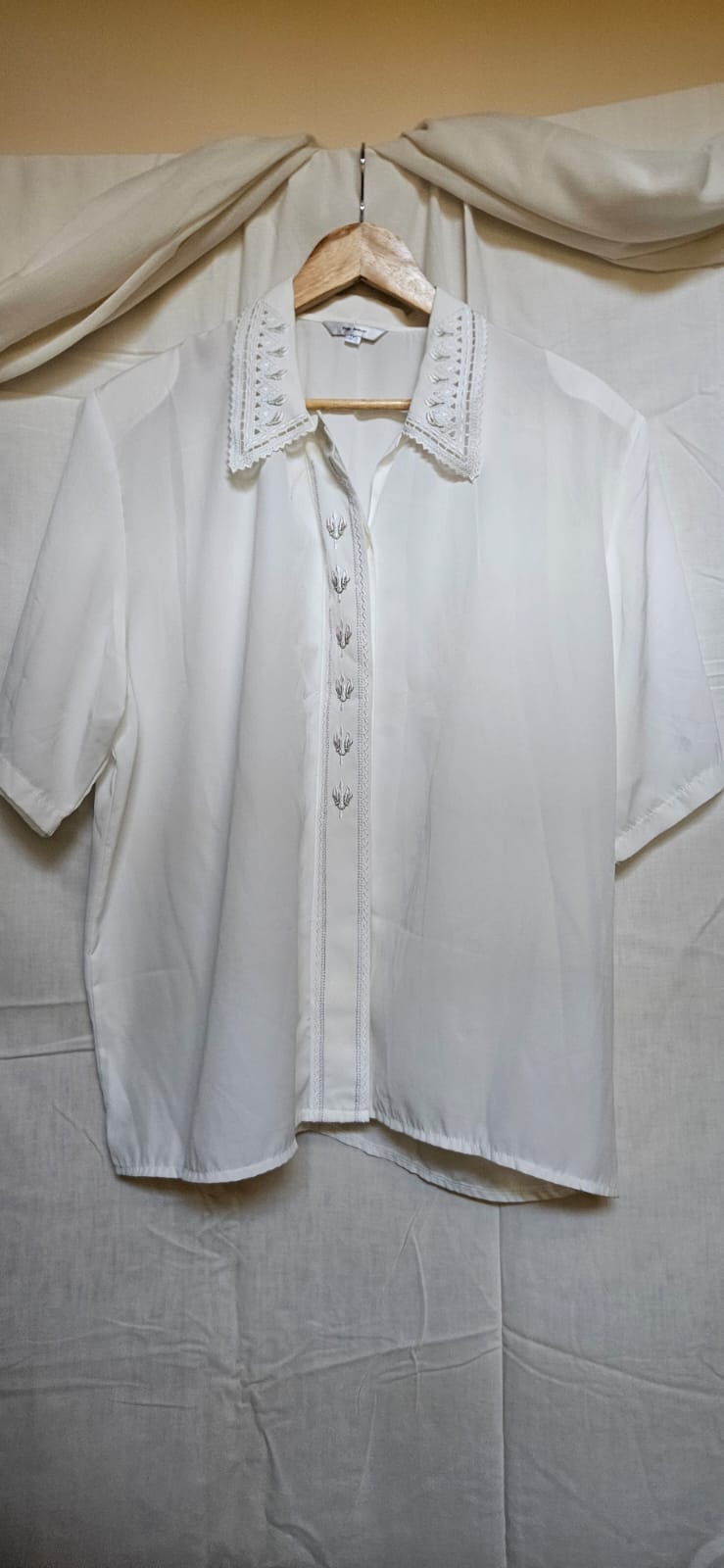 Yoga Italiano vintage ivory blouse on hanger - full front view
