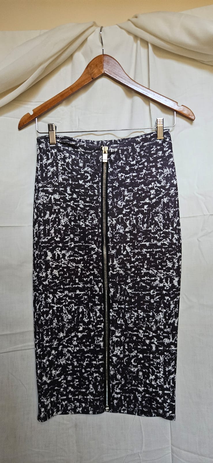 Black and white splatter print midi skirt on hanger