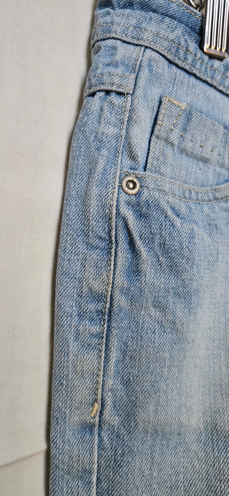 Jannwear light wash denim mini skirt on hanger, front view
