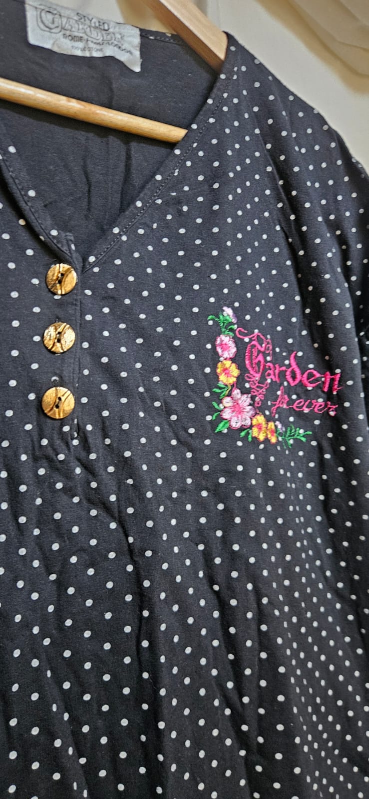 Garden Fever floral embroidery and gold button detail close-up