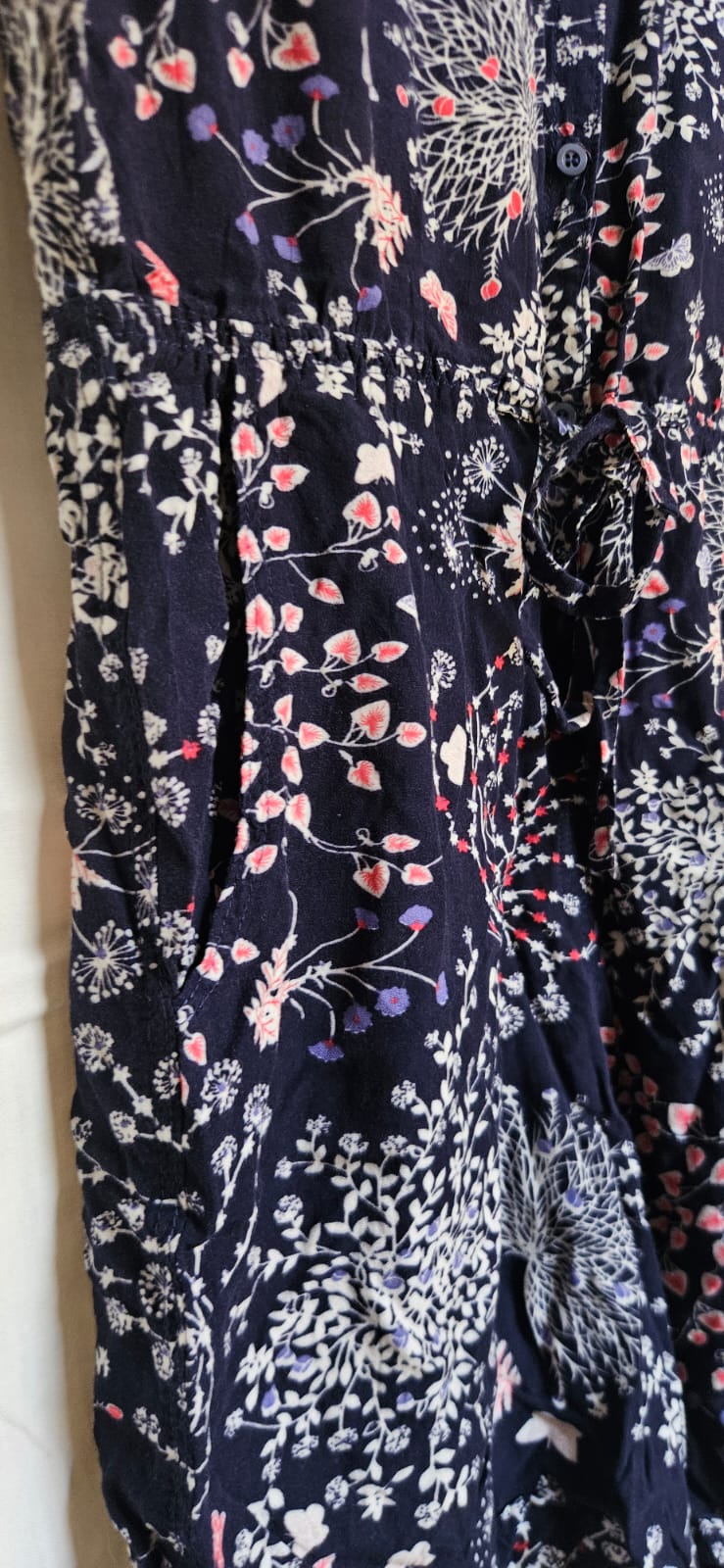 Navy floral dress waist and button detail close-up