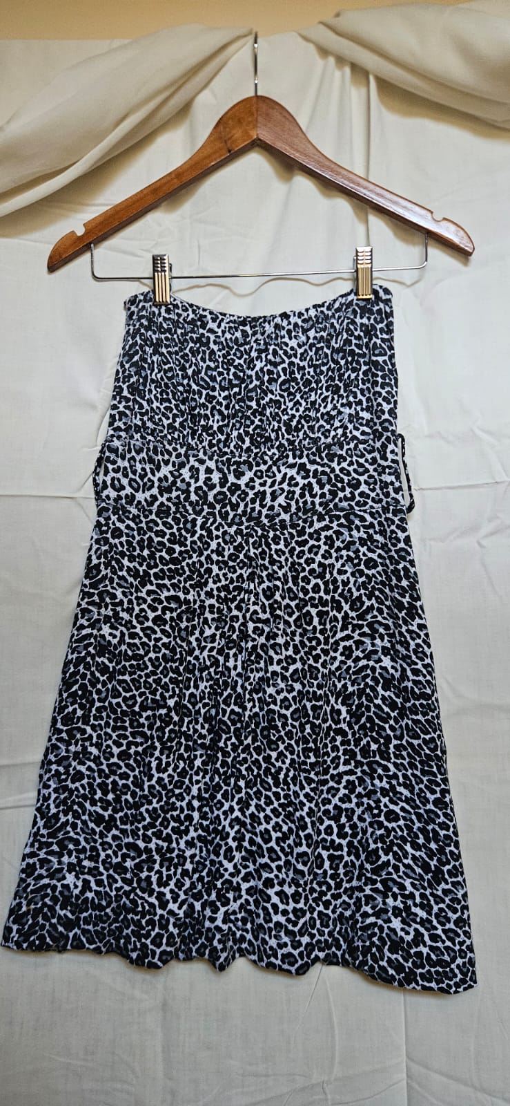 Black and white leopard print midi skirt on hanger
