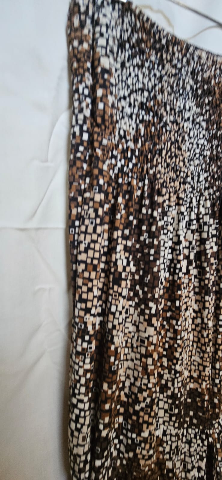 Wide-leg trousers hem and fabric detail