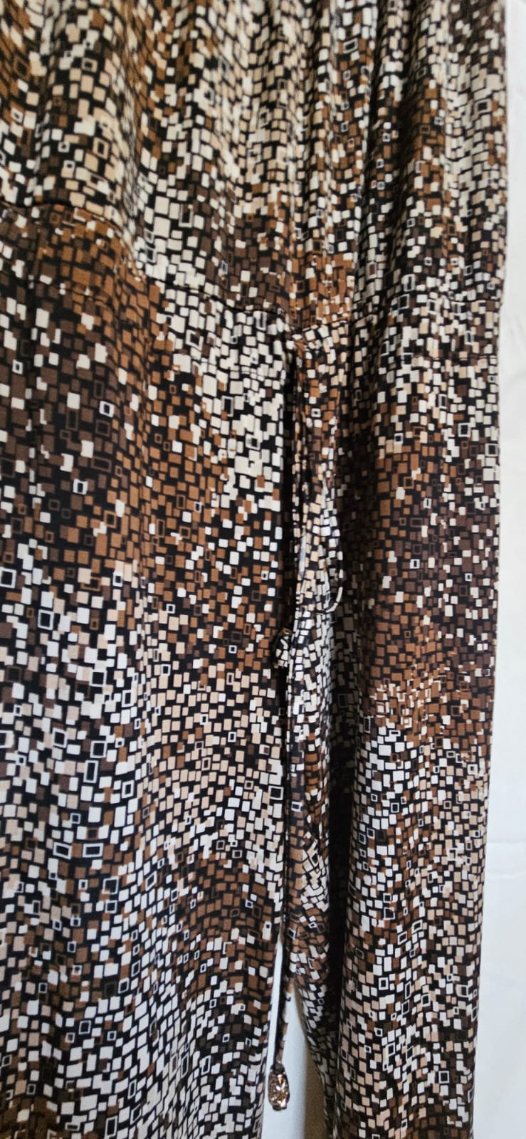 Mosaic print trousers fabric detail close-up