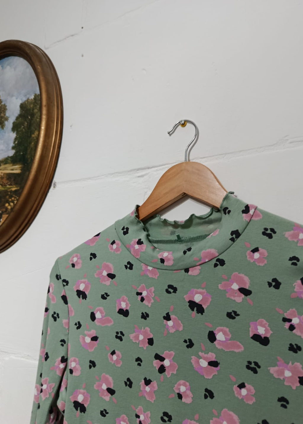 Sage green long-sleeve top with pink and black floral print