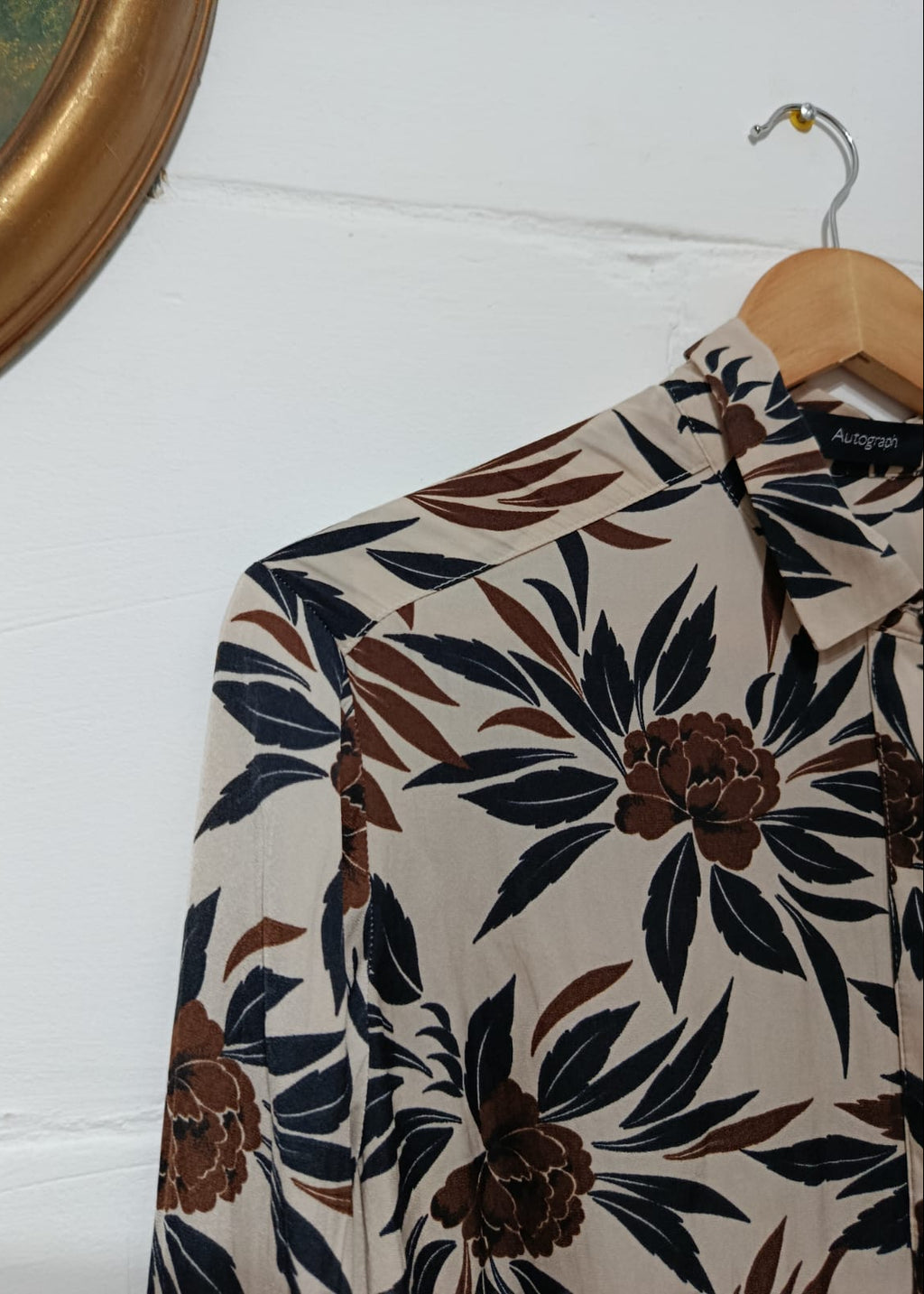 Close-up of the navy and brown floral print on an Autograph blouse