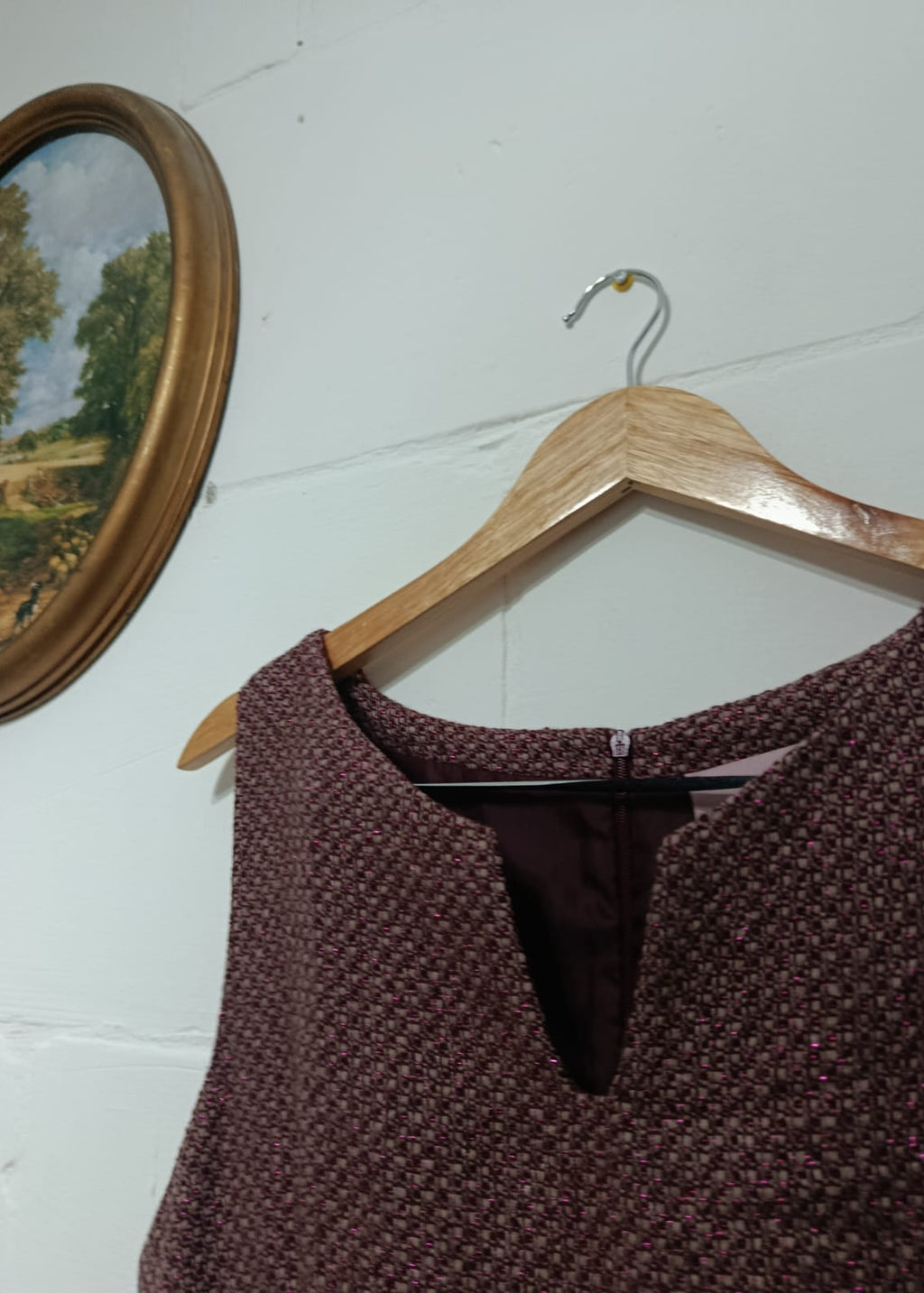 Close-up of the textured neckline on an Axiome Women burgundy sleeveless dress