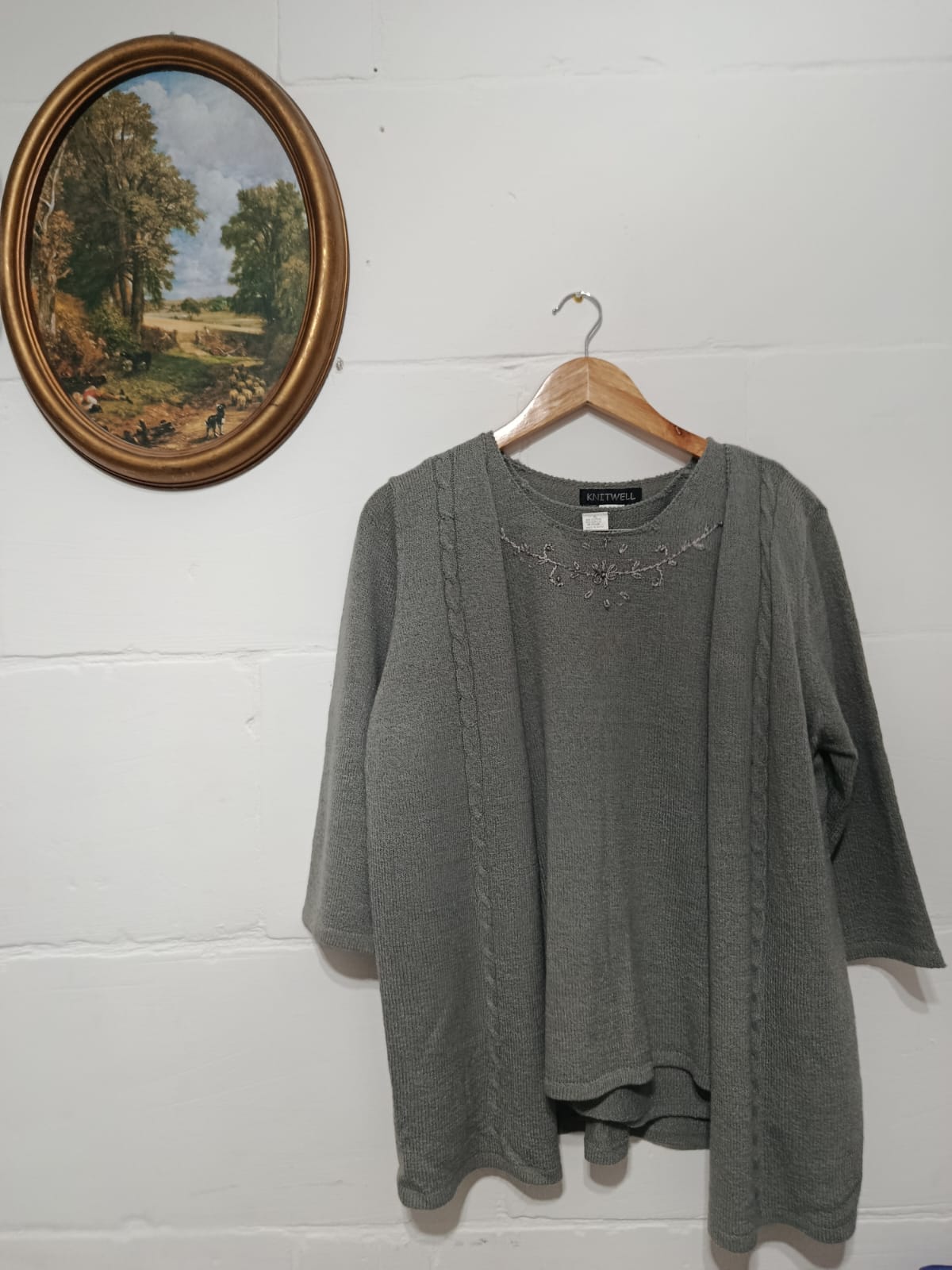 Grey long-sleeve cardigan layered over a matching embroidered sleeveless top