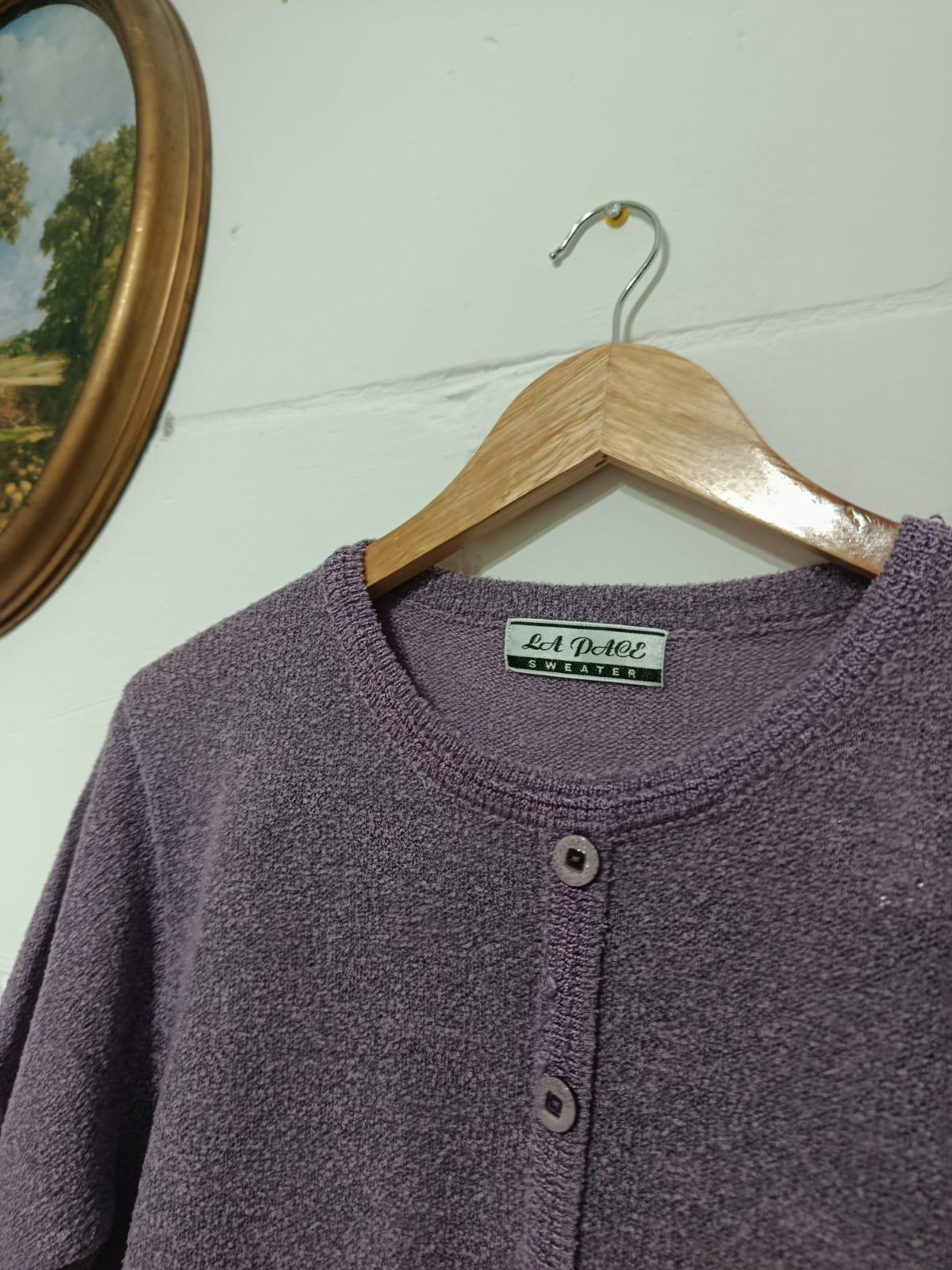 Close-up of the La Dore Sweeter label on a vintage lilac-purple cardigan