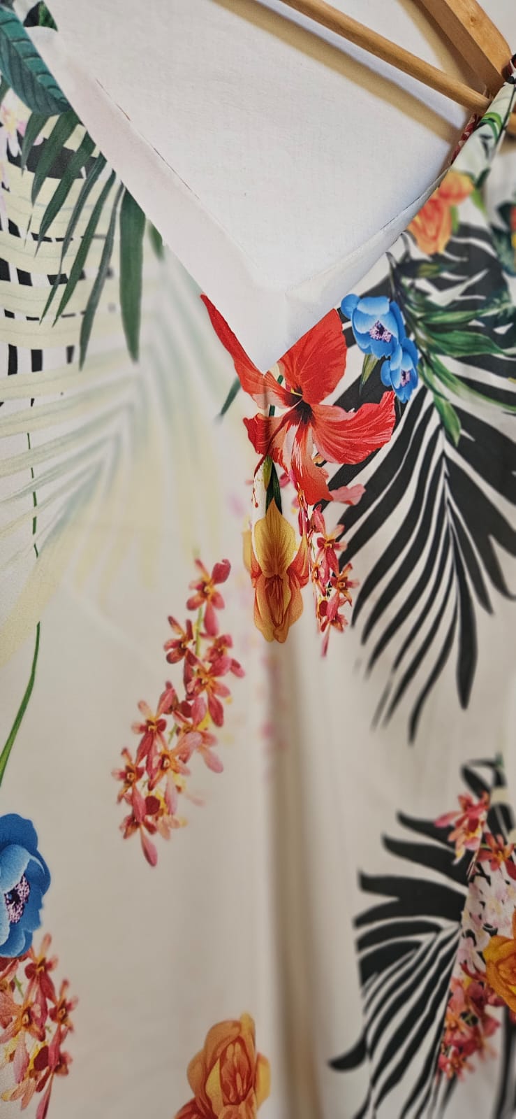 Hibiscus flower dress with colorful leaves on a white background